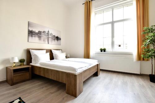 a bedroom with a large bed and a window at Standard Apartment by Hi5 - Bazilika Suite in Budapest