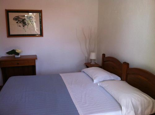 Ένα ή περισσότερα κρεβάτια σε δωμάτιο στο Hotel Villa Antonio