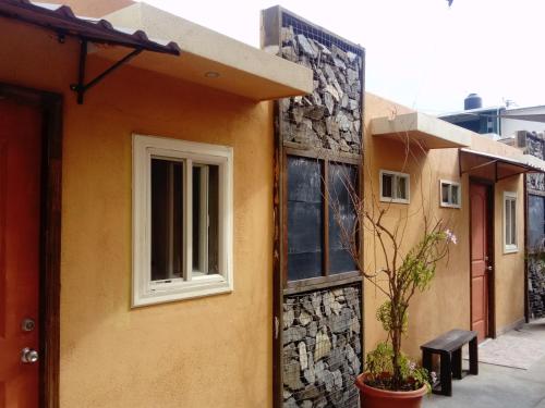 a building with a window on the side of it at Casa Edka in Ensenada