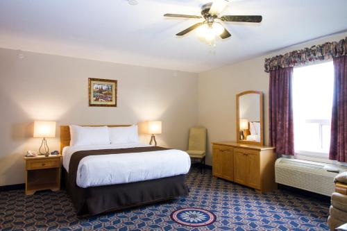 Ένα ή περισσότερα κρεβάτια σε δωμάτιο στο West Country Inn