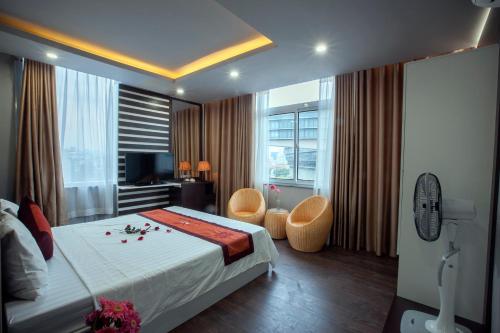 Ένα ή περισσότερα κρεβάτια σε δωμάτιο στο Nam Long Hotel