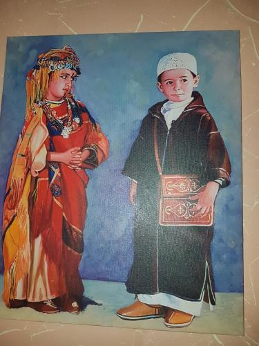 a painting of two people standing next to each other at Résidence MARWA in Ouarzazate