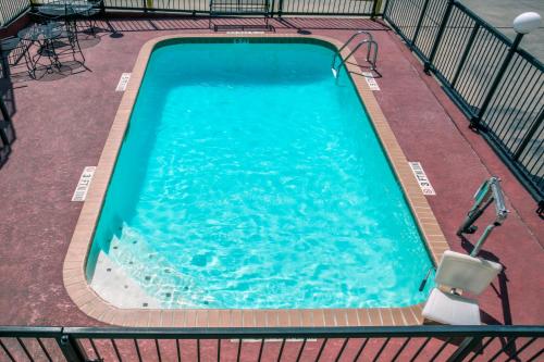 an overhead view of a large swimming pool at Days Inn by Wyndham San Antonio Interstate Hwy 35 North in San Antonio