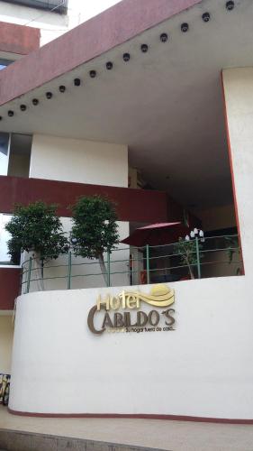 a hotel carrollosa sign in front of a building at Hotel Cabildos in Tapachula