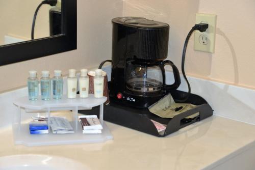 a coffee maker sitting on top of a counter at Irish Inn and Suites in Muleshoe