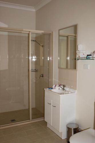a bathroom with a shower and a sink at Yarrahapinni Homestead in Yarrahapinni
