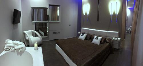 Postel nebo postele na pokoji v ubytování Le Camp Suite & Spa
