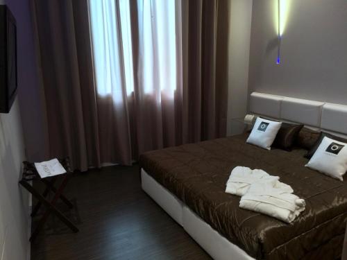 Postel nebo postele na pokoji v ubytování Le Camp Suite & Spa