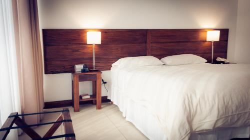Postel nebo postele na pokoji v ubytování Pro Hotel