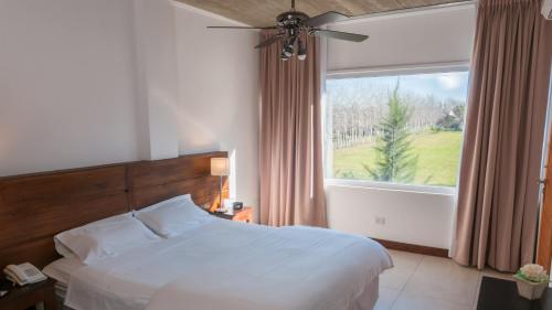 Postel nebo postele na pokoji v ubytování Pro Hotel