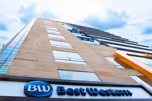 a building with a bus best western sign in front of it at Best Western Haeundae Hotel in Busan