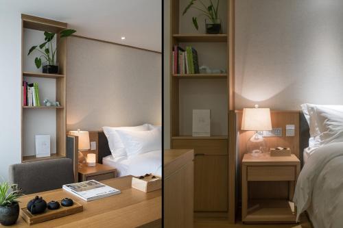 Bai Yun Qin She Boutiqueにあるベッド