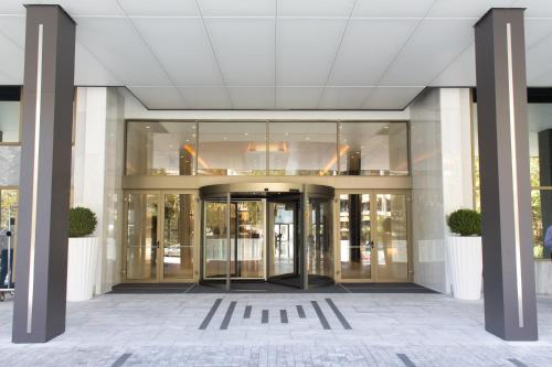 an entrance to a building with glass doors at Makedonia Palace in Thessaloniki