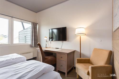 TV a/nebo společenská místnost v ubytování Highland Lodge