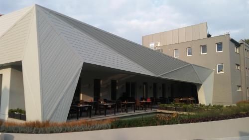 a rendering of a building with a metal roof at Anna Hotel in Budapest