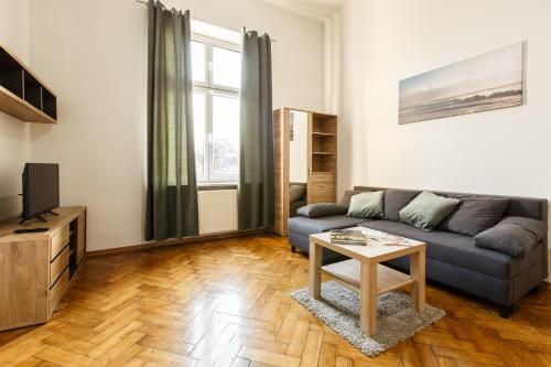 Uma área de estar em Kraków Grzegórzecka Apartments