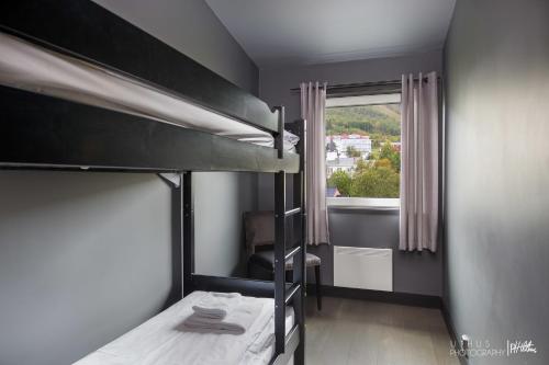 Postel nebo postele na pokoji v ubytování Highland Lodge