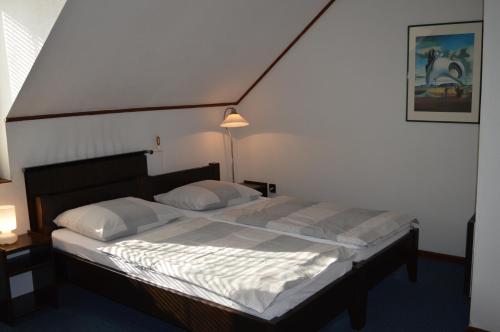 מיטה או מיטות בחדר ב-Margaréta Panzió