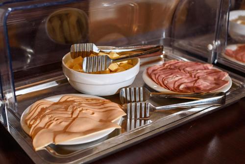 a display case with several different types of food at Omalia Village in Áno Khóra