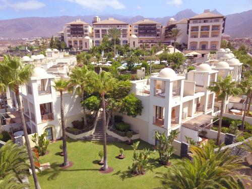 an aerial view of a resort with palm trees and buildings at Vincci Selección La Plantación del Sur in Adeje
