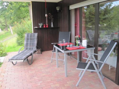 a table and two chairs on a patio at Ferienwohnung Andrea in Eberbach