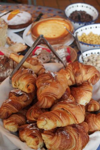 a plate of croissants and other pastries on a table at Hôtel de la Cathédrale Metz in Metz