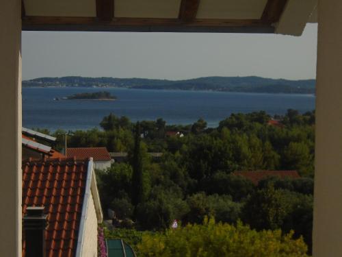 a view of a lake from a window at Apartments Sveti Anton in Orebić
