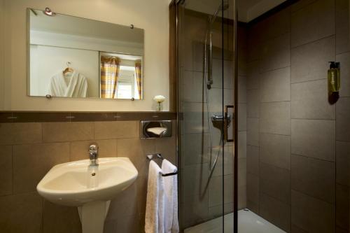 Ванная комната в Hotel Parc Beaux Arts