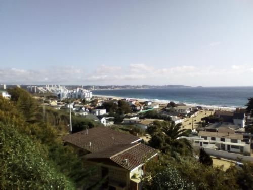 a view of a city and the ocean at Cabaña Vista Bahia Algarrobo in Algarrobo