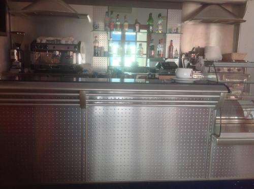 a bar in a kitchen with a counter at Le Torri in Santa Marinella
