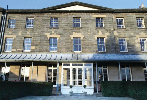 a large brick building with white doors and windows at Hotel Du Vin & Bistro Tunbridge Wells in Royal Tunbridge Wells