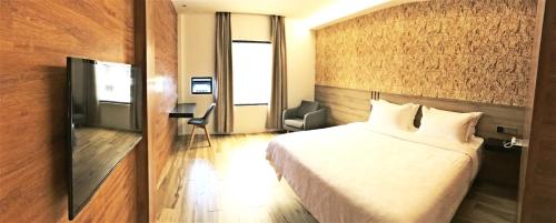 Postel nebo postele na pokoji v ubytování Hotel Legend Boutique
