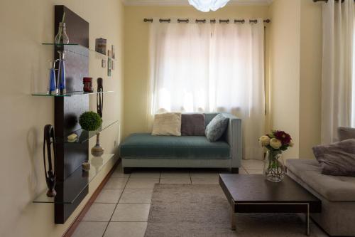 a living room with a couch and a table at Porto RT in Rio Tinto