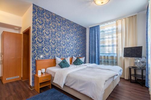 Postel nebo postele na pokoji v ubytování Hotel Bayrischer Hof