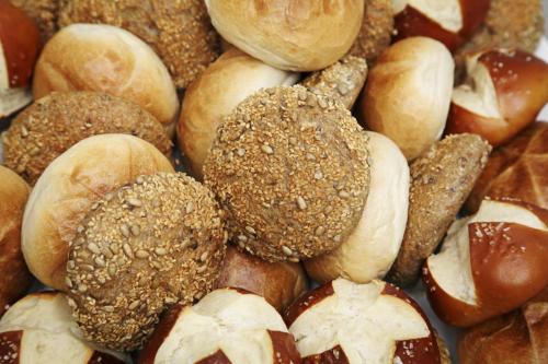 a pile of different types of breads and pastries at Steverbett Hotel in Lüdinghausen