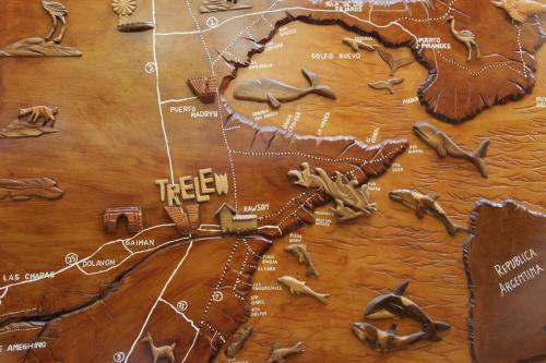 a map of the united states on a wooden table at Hotel Provincia in Trelew