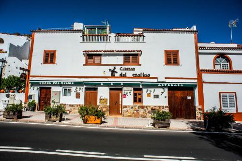 a building on the side of a street at Casa Cueva El Molino By Artenatur in Artenara