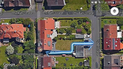 arial view of a suburb with houses and a street at Pension Harleshausen in Kassel