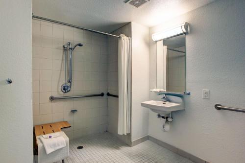 a bathroom with a sink and a shower and a toilet at Motel 6-Santa Ana, CA - Irvine - Orange County Airport in Santa Ana