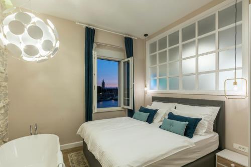Posteľ alebo postele v izbe v ubytovaní Magic View Apartments