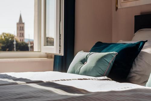 Ένα ή περισσότερα κρεβάτια σε δωμάτιο στο Magic View Apartments