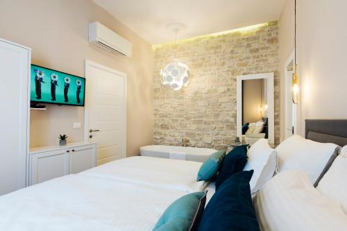 Ένα ή περισσότερα κρεβάτια σε δωμάτιο στο Magic View Apartments