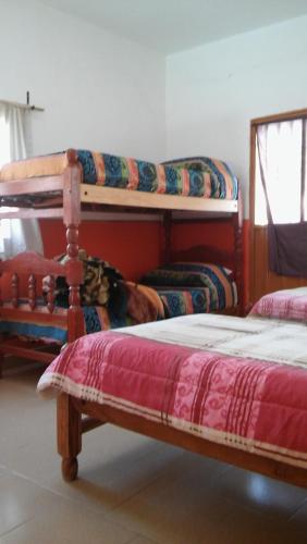 a bedroom with two bunk beds at Cabañas Casa de colores in Maimará