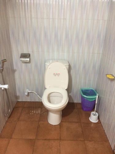 a bathroom with a toilet in a stall at Low budget pilgrim home in Anuradhapura