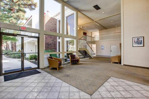 an empty lobby of a building with a staircase at Motel 6-Santa Ana, CA - Irvine - Orange County Airport in Santa Ana