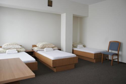 A bed or beds in a room at Pokoje Gościnne Centrum Kultury Prawosławnej