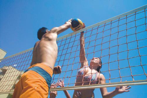 two men playing a game of volley ball at Titan Club Hotel Ultra All Inclusive in Kargicak