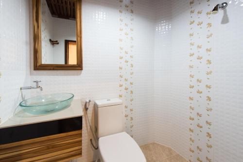 a bathroom with a sink and a toilet at Thongphaphum River in Thong Pha Phum