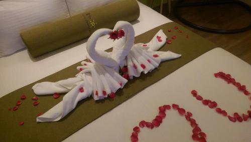 a cake with two swans on top of a table at Early Summer in Luodong