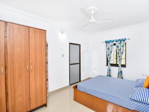 Ένα ή περισσότερα κρεβάτια σε δωμάτιο στο Goaesha Apartment